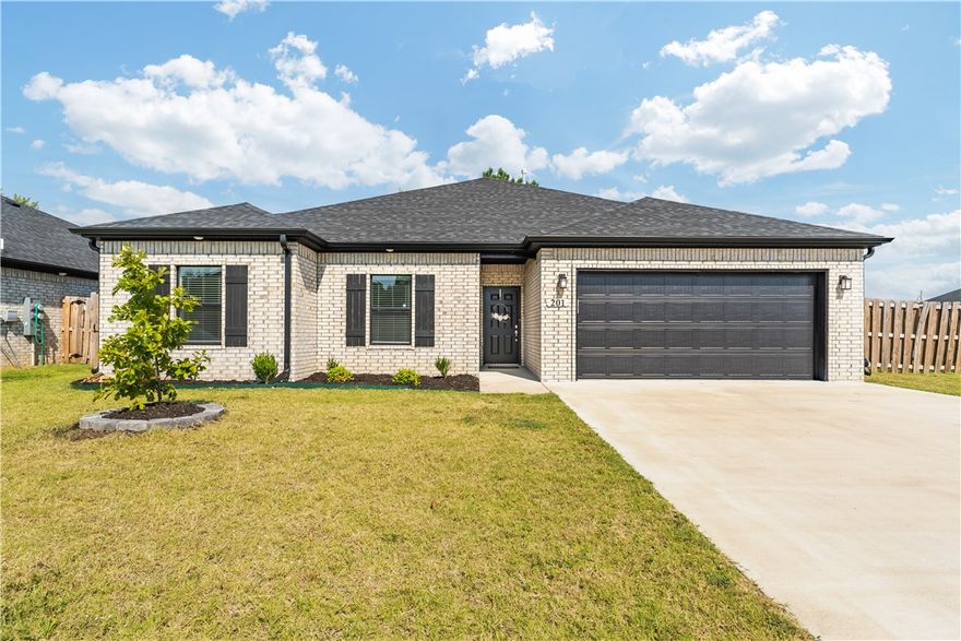 Up to $3400 in a preferred lender credit!! To be used toward interest rate buy down or closing costs. Nestled on a corner lot just steps from Pop Allum Park & biking trails, this 2022-built home is move-in ready, only 1 mile from downtown Gravette & 20 miles from the new Walmart HQ. The open-concept floor plan features a welcoming living room w/a gas fireplace that flows into an eat-in kitchen w/granite counters, gas cooktop, walk-in pantry, & a spacious island w/bar seating. The split-floor plan design provides privacy, w/two guest rooms on one side & the luxurious primary suite on the other. The primary retreat includes a spa-like ensuite w/dual vanities, soaking tub, walk-in shower, & an expansive closet. Outside, enjoy your private, fully-fenced backyard that features a newly installed tile patio & ambient lighting. Luxury vinyl flooring throughout, & energy-efficient appliances. Designed for convenient everyday living, & has solar to help save on bills!