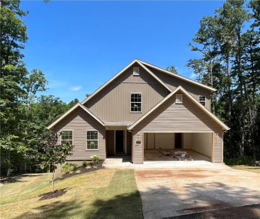 Check out this stylish new construction in Bella Vista! It features two levels with three bedrooms with walk-in closets, an office, 2.5 bathrooms, and an open kitchen/dining/living room with fireplace, along with a 2-car garage. Enjoy comfort and style with amenities such as 3 cm granite countertops, LED disk lighting, a Frigidaire Gallery appliance package, and full aluminum guttering. The home is conveniently located near Lake Rayburn, bike trails, and is just a short drive from downtown Bentonville!