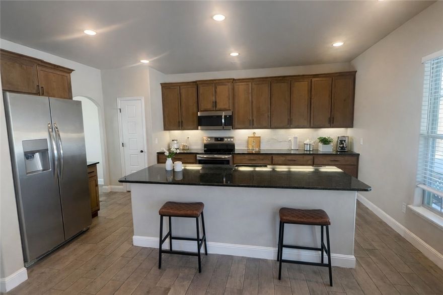 11 MINUTES TO DOWNTOWN and 2.5 miles to the interstate!!! This home flexes 4 bedrooms and 3 full bathrooms, including a bonus en suite. Laundry is UPSTAIRS because all the bedrooms are upstairs. Beautiful backyard with covered patio and extra gazebo. The home is practically brand new and perfect for a large family where everyone needs a space.