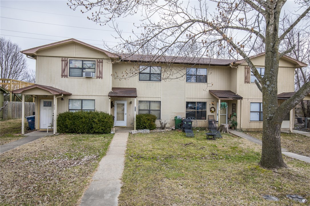 Close to 8th Street Market and Downtown Bentonville. 2 bedroom 1 1/2 bath town home. Tile flooring thru main living area carpet in bedrooms. Refrigerator included. Small fenced yard area.