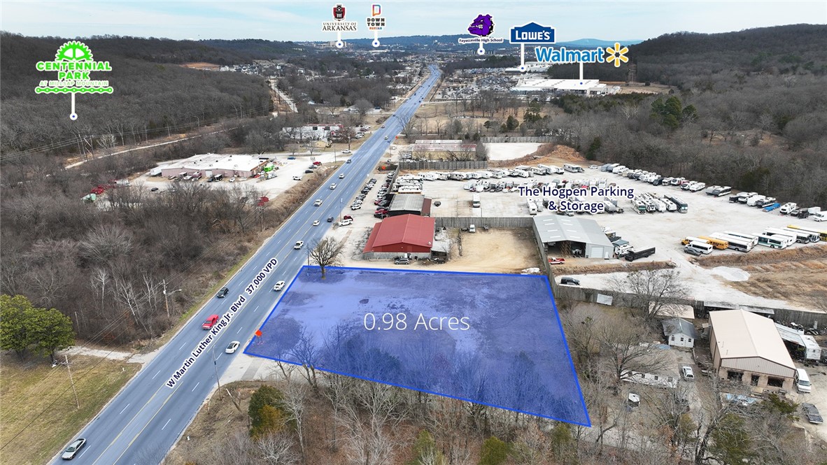 Great development potential on 0.98 acres of commercial land off bustling W Martin Luther King Jr. Blvd in Fayetteville, Arkansas. Situated between nationally recognized retail such as a Walmart Supercenter and Lowe’s. Centennial Park and future middle school campus are within a short drive as well as the University of Arkansas campus and Fayetteville High School. Location provides great convenience to commuters from Farmington and Prairie Grove and is in a direct path of growth.