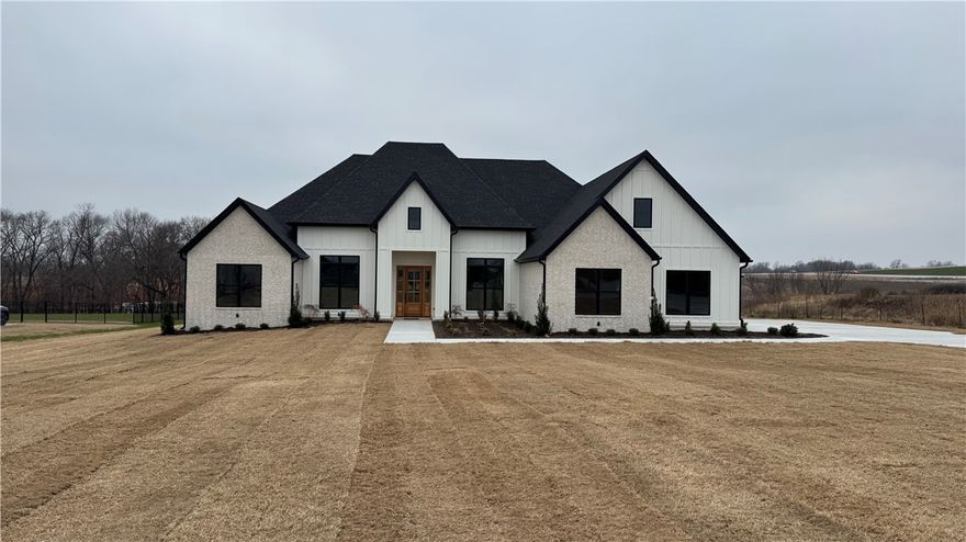 Dreaminess and Location in one home! This charming new construction home is right near the new by-pass exit on 412!  A large lot at 1.74 acres, this beautiful property offers 5 bedrooms plus an upgraded office, 3.5 baths, and 3553 sq ft of thoughtfully designed living space! Being at the end of the street it feels open and spacious.  As you enter the home you are met by a vast  vaulted wood ceiling! On your right the gourmet kitchen includes 10’ full-height custom cabinets, a natural gas range, large island, and exquisite attention to details. The primary suite offers a large soaking tub, tile shower, his/her vanities, and a large walk-in closet. From the central vacuum system to built ins- there are upgrades everywhere! The covered back porch is welcoming and open, perfect for enjoying the back yard. Come see this stunning home!