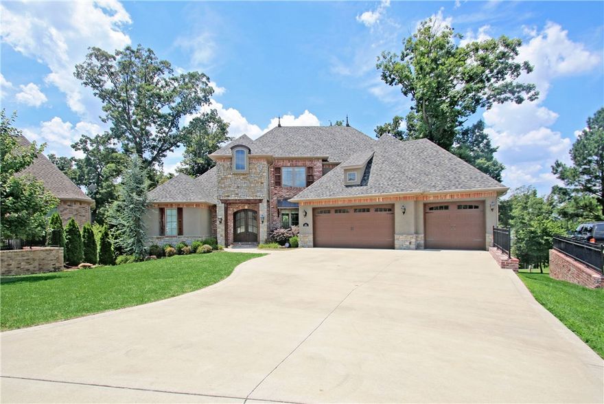 GOLF FRONT CUSTOM-BUILT DAVID HARRIS HOME OVERLOOKING 8TH GREEN & 9TH FAIRWAY! FABULOUS AMENITIS THROUGHOUT WITH LOTS OF UPGRADES!  3 LEVELS with 6 BEDROOMS and 4.5 BATHS. Huge gourmet kitchen open to beautiful living room with high vaulted beamed ceilings and fireplace all enjoying sweeping views of the golf course!  Luxury master suite & amazing en suite bath!  Walk-out basement offers a living area w/ kitchen, bedroom & full bath creating option for a guest/in-law suite!  2 levels of decking space and outdoor kitchen! AMAZING STORAGE SPACE!