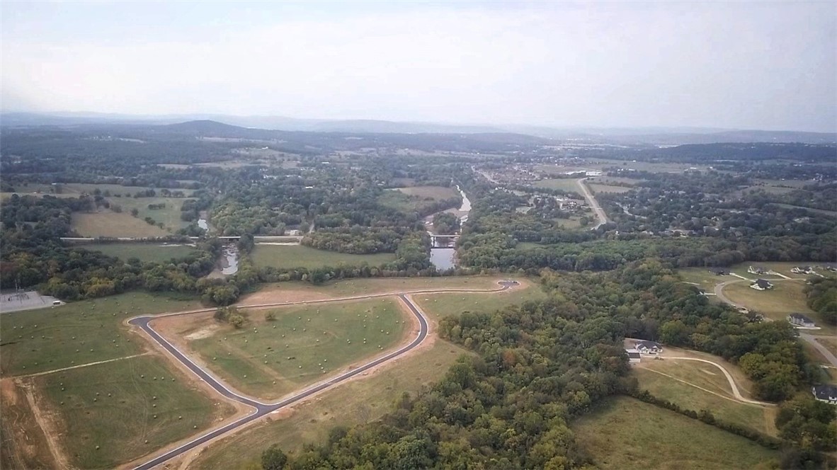 Welcome to East Fayetteville and Goshen's newest subdivision Asher Ranch. Located next to the White river and only 15 minutes to Fayetteville. Enjoy the the peacefulness of being surrounded by trees and views of rolling hills and still so close to town. This subdivision has so much to offer. Located in East Fayetteville school district, large 1 acre plus lots, next to White River, views of NWA mountains, and so much more.