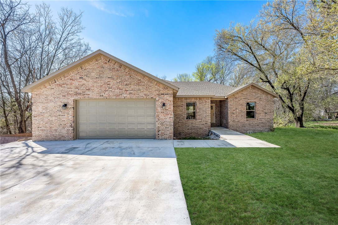 Welcome to your new home! Granite countertops check; brick exterior on all four sides, check; a large kitchen island, check; a luxurious main suite with a walk-in closet, check; an outdoor deck space; check; a large garage with additional space; check! At an excellent location sitting on over a half-acre next to a city park, this 4-bed house is spacious outside and inside with an open kitchen, dining, and living space to make you the first owner of this great newly built home. Offering a $3000 credit towards buyer CC, up to an additional $3000 with preferred lender. Up to a $6000 credit with preferred lender.