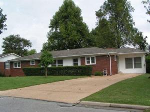 4BR 2BA Brick, Vinyl & Wood siding home with lots of sq. ft.- Hardwood floors, 2-car garage, living room, dining room, huge den with fireplace on tree shaded lot. Other features include; covered deck, pantry & storm shelter. Roof replaced 2010, windows replaced 2005, tiles installed 2005, storm room completed 2009, water heater 2015.Call for more details.