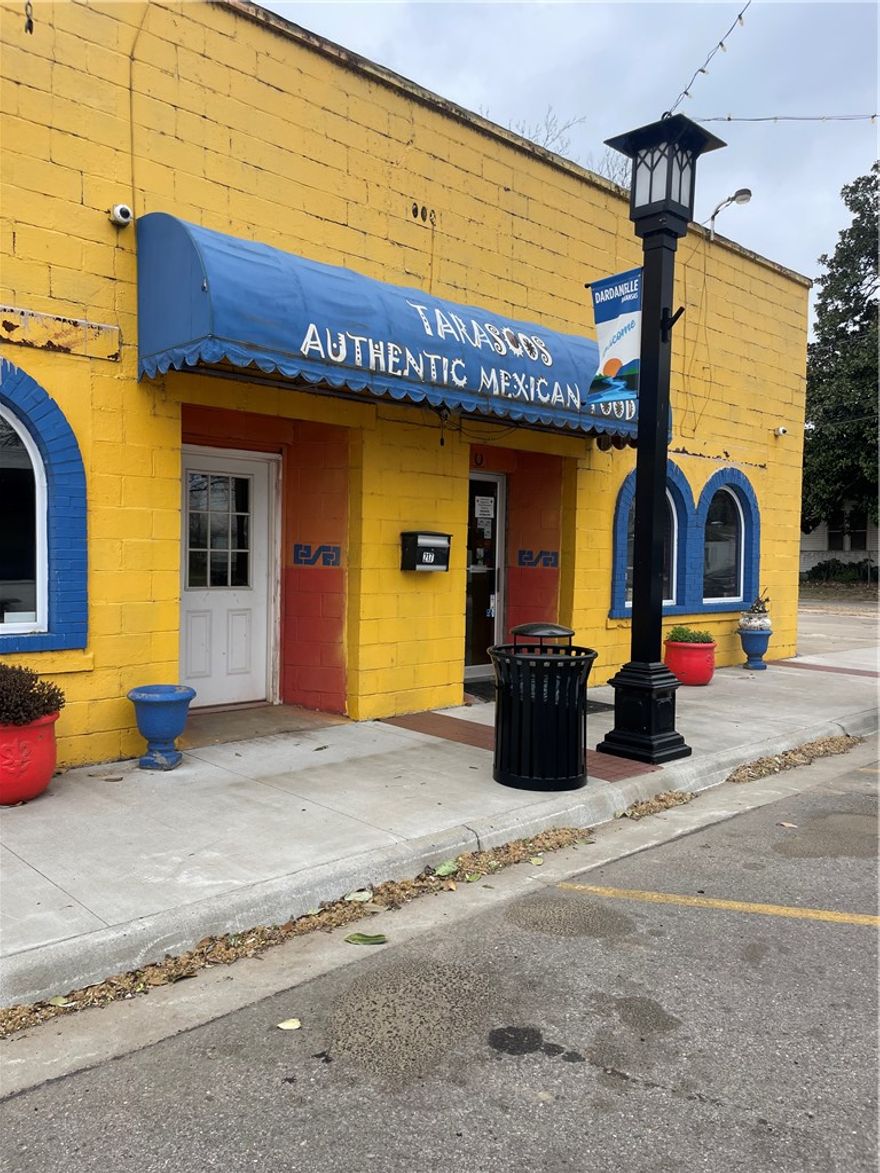 Rare opportunity for anyone looking to expand or enter the restaurant business! 
Situated prominently in Dardanelle on historic Front Street, ensuring high visibility and foot traffic. 
The property itself is part of the sale, providing a solid foundation for your business.
All necessary kitchen equipment, walk in coolers, and furnishings are included, allowing for immediate operation.
A collection of dishes and recipes will help maintain continuity or inspire new menu creations. The inclusion of a liquor license is a significant advantage, facilitating a full-service dining experience.
Ample parking space available, making it convenient for patrons. An inviting outdoor seating area that can enhance the dining experience.
You have the option to maintain the current operations or rebrand and customize it to fit your vision.
This is a great chance to step into a well-established business in a vibrant community. Whether you're an experienced restaurateur or a new entrepreneur, the potential here is significant.