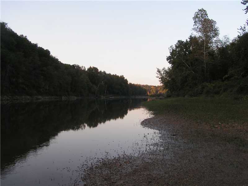 Real nice 24 acres m/l with a one room cabin on the Kings River. This property borders the US Corps of Engineers property on Kings River.