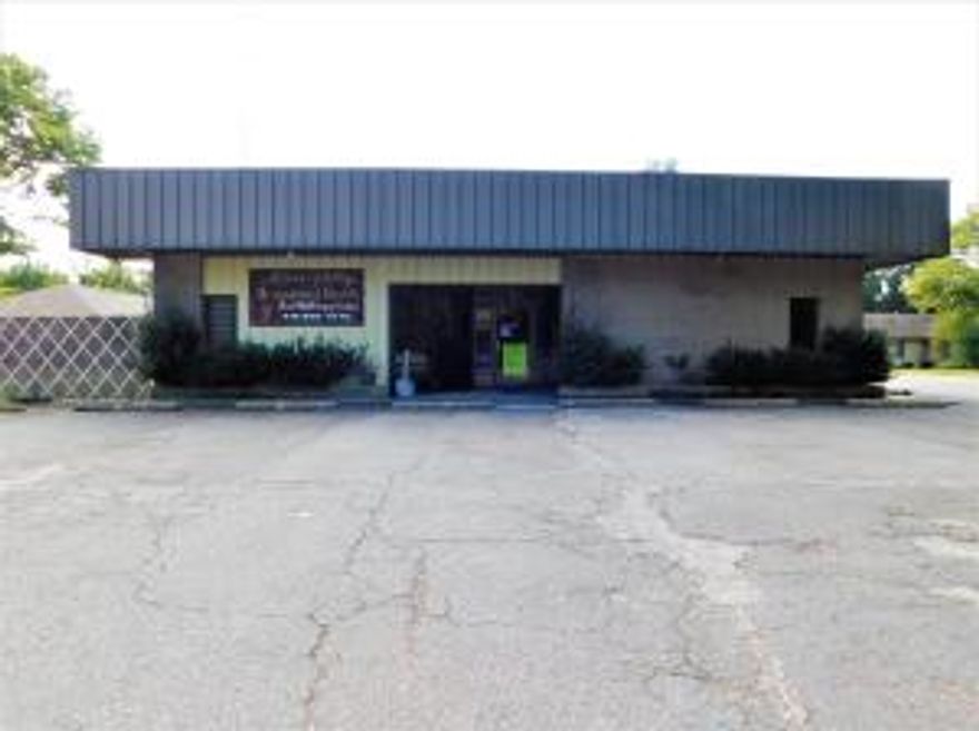 Exceptionally designed medical office with 8 separate offices, 2 Testing Rooms, 3 Exam Rooms, Laboratory, Large & Medium size conference rooms, X-Ray Room, Large Lobby & Reception Office, 2 Bathrooms and ample warehouse space in back of this 5,000 square foot metal building. This building sets on a large commercial lot with ample parking in front of the building on the North side and additional parking located along the West side of the building.  The East side of the Lot is fenced for business vehicles and equipment.  The entire floor plan is attached hereto as well as a Survey to the Lot.  This building and site are move-in ready for a medical office or related business. All interior office space is heated and cooled.