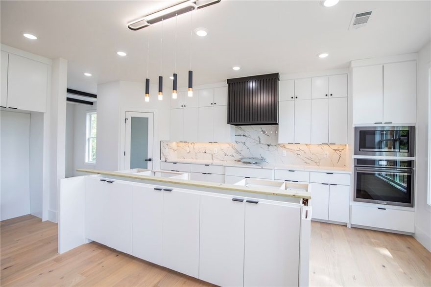 Another Beautiful collaboration between 12 Stone Construction & Design and HSK!  Contemporary design lets the outside in showcasing the surrounding Ozark Mountains!  Yet mere minutes to the new Walmart campus, Downtown Bentonville and world-class restaurants and museums and just steps to the Grammercy trailhead.  Luxurious details abound from the spa-like shower bars to the designer wall and ceiling treatments to the smart home features, every feature has been carefully thought out and chosen. True Five bedroom with additional dedicated spaces for office, dining, exercise, and media room.  PLus two living areas--one up and another downstairs!