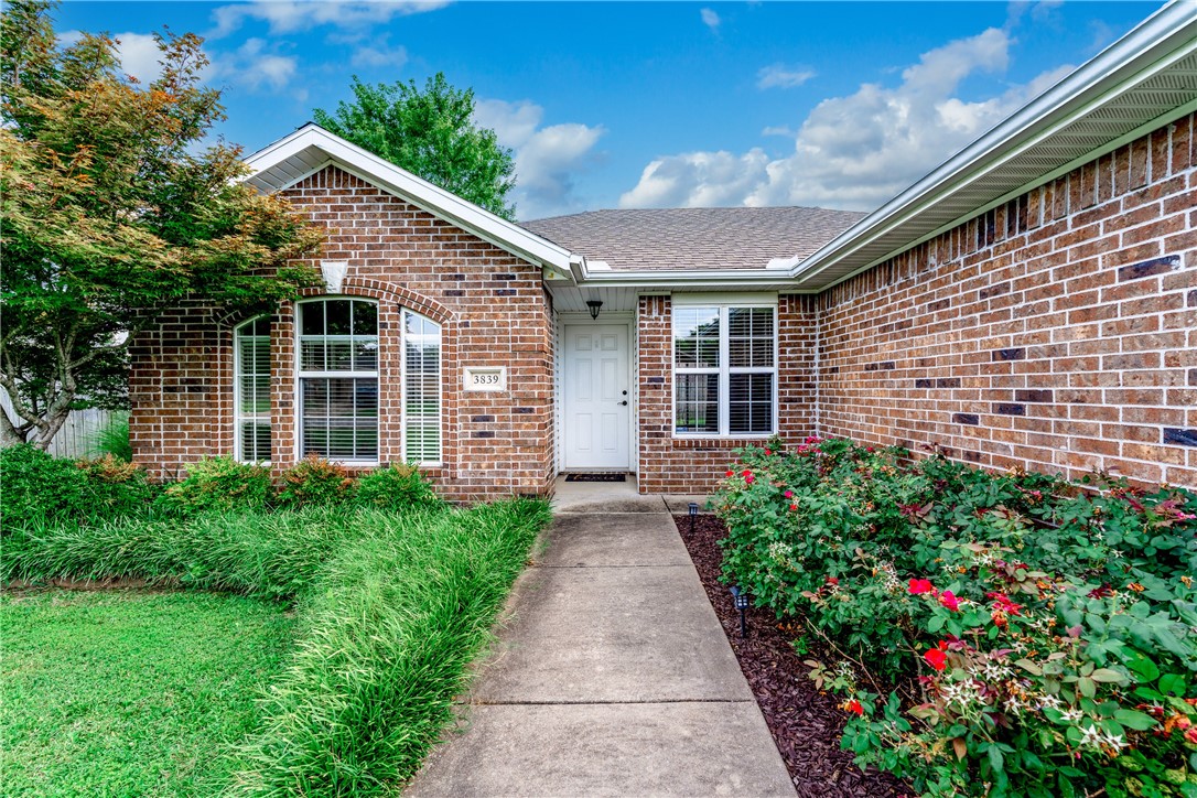 Charming all brick home in Clabber Creek subdivision. Move-in ready with fresh paint and new carpet. Lots of natural light with perfect 3 bed/2 bath split floor plan. The living area features wood floors, gas log fireplace with spacious mantle. The primary suite has 2 walk-in closets and shower. A new electric stove, granite countertops and wood cabinets anchor the kitchen. The laundry room has extra storage plus a pantry. Wood privacy fence in the backyard with large concrete patio. Covered patio on the front with landscaped beds. 2025 HVAC and 2020 roof. Convenient to I49, schools, shopping and the Clabber Creek Trail. Refrigerator to convey.