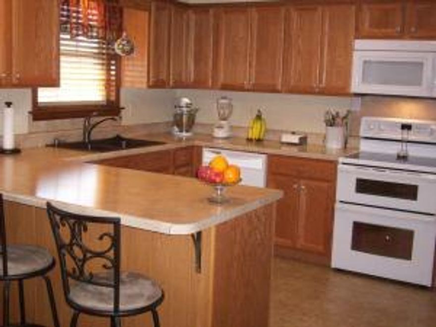 Lovely 3Bd/2Bth with office on Pryor Lane!!!  Large laundry room, carport with storage area & an outbuilding!  A  refreshing remodel that includesan entertainment deck, new windows & new electric panel!  Roof is 8 years old.