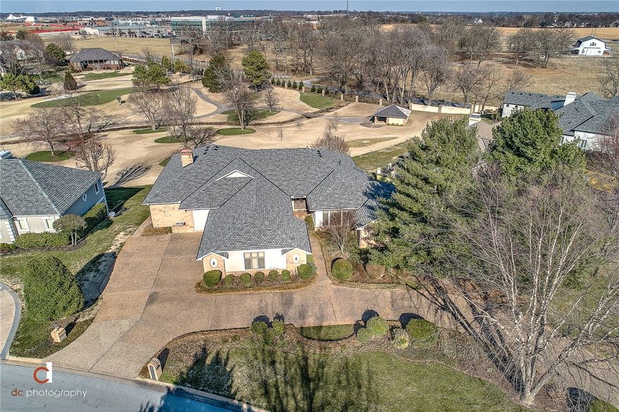 FABULOUS ONE LEVEL CUSTOM-BUILT, ONE OWNER GOFL FRONT PINNACLE HOME BOASTING SWEEPING VIEWS OF THE 13TH FAIRWAY!  Located in the heart of Southwest Rogers just minutes from shopping, restaurants, I-49, trails, hospital and more!  Split floor plan with spacious and private master retreat enjoying amazing views!  Large open concept living/dining/kitchen area looking out to the golf course.  Open formal dining, 2nd living area, private office/study, large bonus room, 2 additional bedrooms each featuring an en suite bath.  Large covered, tiled veranda with built-in grill and gorgeous backdrop!!