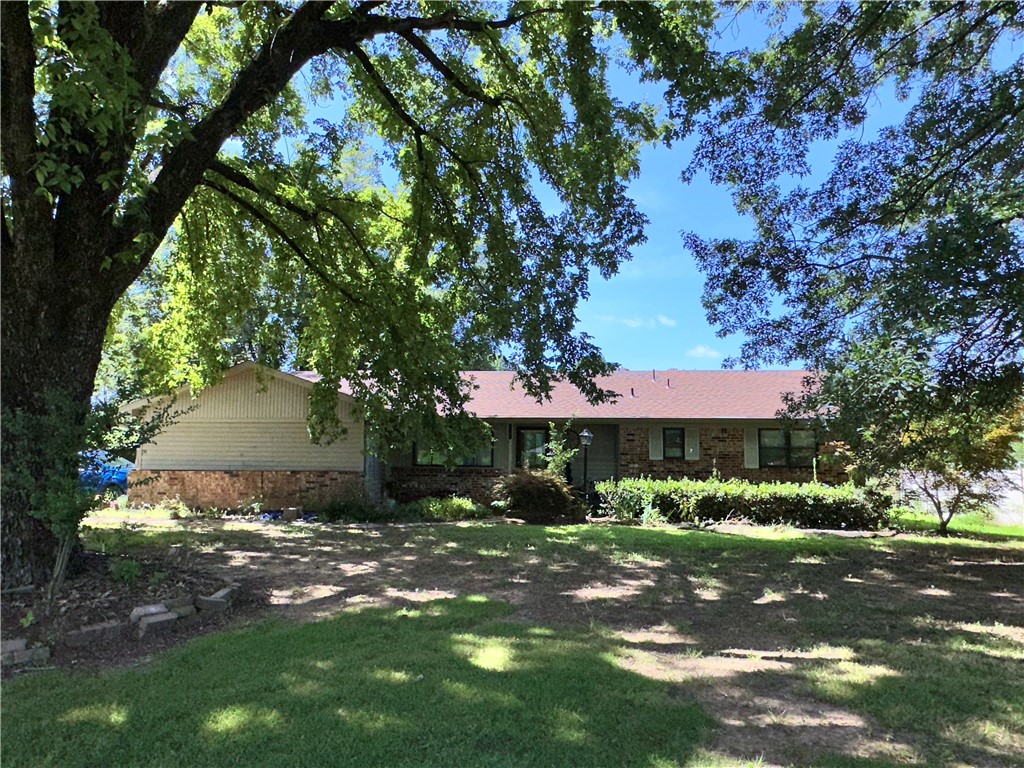 Charming and full of character, this well-maintained home at 2605 W Commercial St offers the perfect blend of comfort, convenience, and small-town charm. Featuring 3 bedrooms and 2 bathrooms, this inviting residence sits on a spacious lot with mature trees and plenty of room for outdoor enjoyment. Inside, you'll find a warm and welcoming living area, a functional kitchen with ample cabinet space, and generously sized bedrooms with natural light throughout. Whether you're a first-time homebuyer, looking to downsize, or seeking an investment opportunity, this home provides endless potential. Located just minutes from downtown Ozark, schools, shopping, and Highway 64, this property is both peaceful and conveniently accessible. Donāt miss the chance to make this charming home your own!