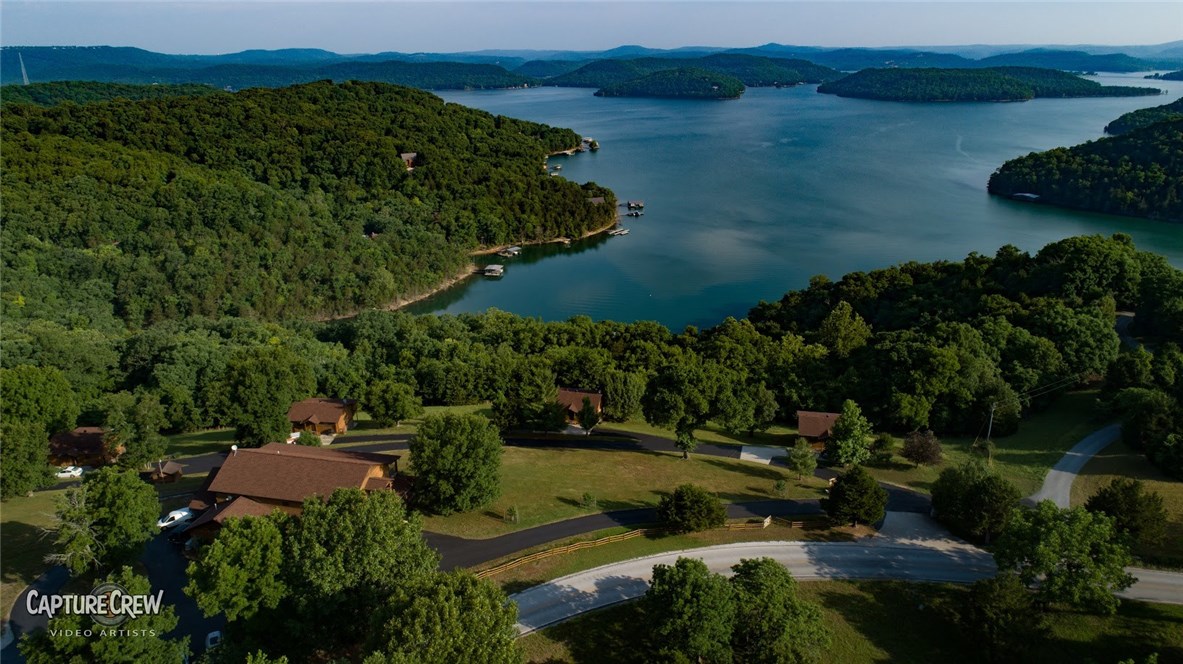 Prime location Beaver Lake cabin resort with large commercial boat dock on beautiful Beaver Lake cove. 10 cabins, retail convenience store, office, laundry & 8 slip commercial dock with large swimming platform. Very profitable family oriented resort with high occupancy from loyal customers. Year round destination for family gatherings, escapes, small weddings and anniversary parties. Cabins have wood burning fireplaces & rustic style furnishings.