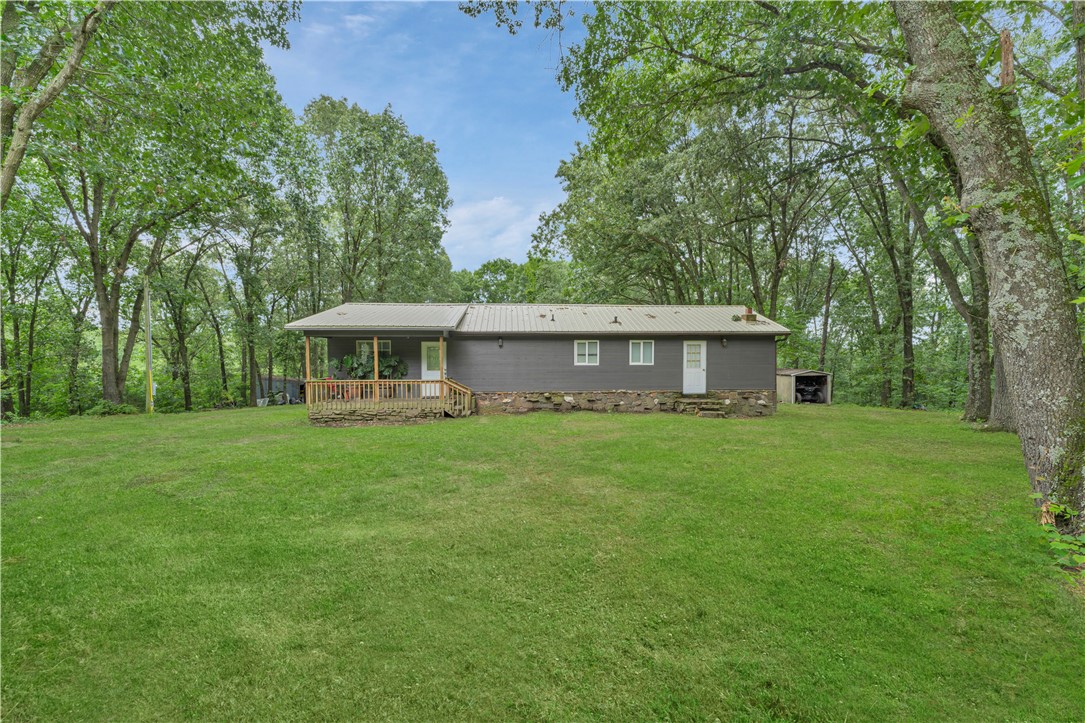 Tucked away in the heart of Madison County, this charming 2-bedroom, 1-bath cabin sits on a stunning 19-acre wooded retreat—offering the perfect mix of privacy, nature, and convenience. Thoughtfully maintained, the home features an updated kitchen, a tiled walk-in shower, and a spacious open living area filled with natural light from large windows that frame the scenic outdoors. Approximately 3–5 acres have been thoughtfully cleared, providing room for gardening, outdoor activities, or potential expansion, while the remaining acreage is covered in beautiful, mature hardwoods—ideal for hunting, hiking, exploring, or simply enjoying the peaceful seclusion. Whether you're looking for a weekend getaway, a hunting cabin, or a permanent escape to the woods, this property has it all. Just 1 mile off Highway 412 and a quick 30–35 minute drive to Springdale or Fayetteville, this hidden gem offers the best of both worlds—serenity in nature and access to town. Come enjoy all that the Ozarks have to offer!