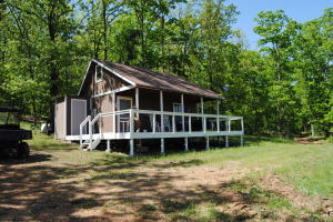 RIVER FRONT PROPERTY, ON RED RIVER, 32 ACRES WITH A MOVE IN READY CABIN, ALL FURNISHED, PRISTINE VIEW, DRIVE RIGHT DOWN TO THE RIVER , COVERED PORCH AND HALF DECK, GRILL, WASHER AND DRYER CONNECTIONS , HAS ALL APPLIANCE TO CONVEY, PROPANE TANK WITH GAS, NEW UNIT IN WINDOW FOR HEAT AND COOL. METAL ROOF, GUTTERING, STORAGE SHED, RURAL WATER, CERAMIC FIREPLACE , UPSTAIRS BEDROOM, ALL TONGUE AND GROOVE WOOOD, TIN CEILING, EXTRA INSULATION SIDING , ALL NEW PLEX PIPE , PASTURE FOR A HORSE, GRAVEL ROAD TO THE HOME, VERY PRIVATE SETTING NO NEIGHBORS TO SEE.
