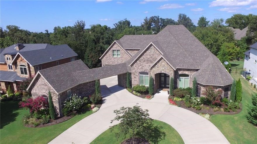 Modern Unique Luxury at its Finest in gated Pinnacle Country Club! Custom-designed, lavish features inside/out. Heavy iron double doors greet guests as enter Open Modern-Flair Floorplan w/Dining Room, 2 Living Rooms w/Sleek Fireplaces, Study, Craft Room, Wet Bar, & Butlers pantry. Chef's dream Kitchen w abundance of Counterspace & Cabinetry, large Island, new Commercial grade Range, Sub-zero Fridge & walk-in Pantry. Expansive Master Bedroom/Bathroom offer luxurious amenities- Private Patio Access, pampering w showcase jetted Tub, dual Sink stations, double-doored Shower, Towel warmer, large Walk-around Closet. 2nd Master EnSuite on Main Level w direct Patio Access too. Upstairs offers Separate Bedroom w Private Bath, 2 Bedrooms w JacknJill Bath, & Huge Media Room w Storage. Gorgeous backyard w Elm trees/Arborvitaes for shade/ beauty. Architect designed retaining wall for better yard use/pool install. Circular drive & covered breezeway bw 3 oversized garages.Desirable quiet street in Bentonville schools. Smart Home.