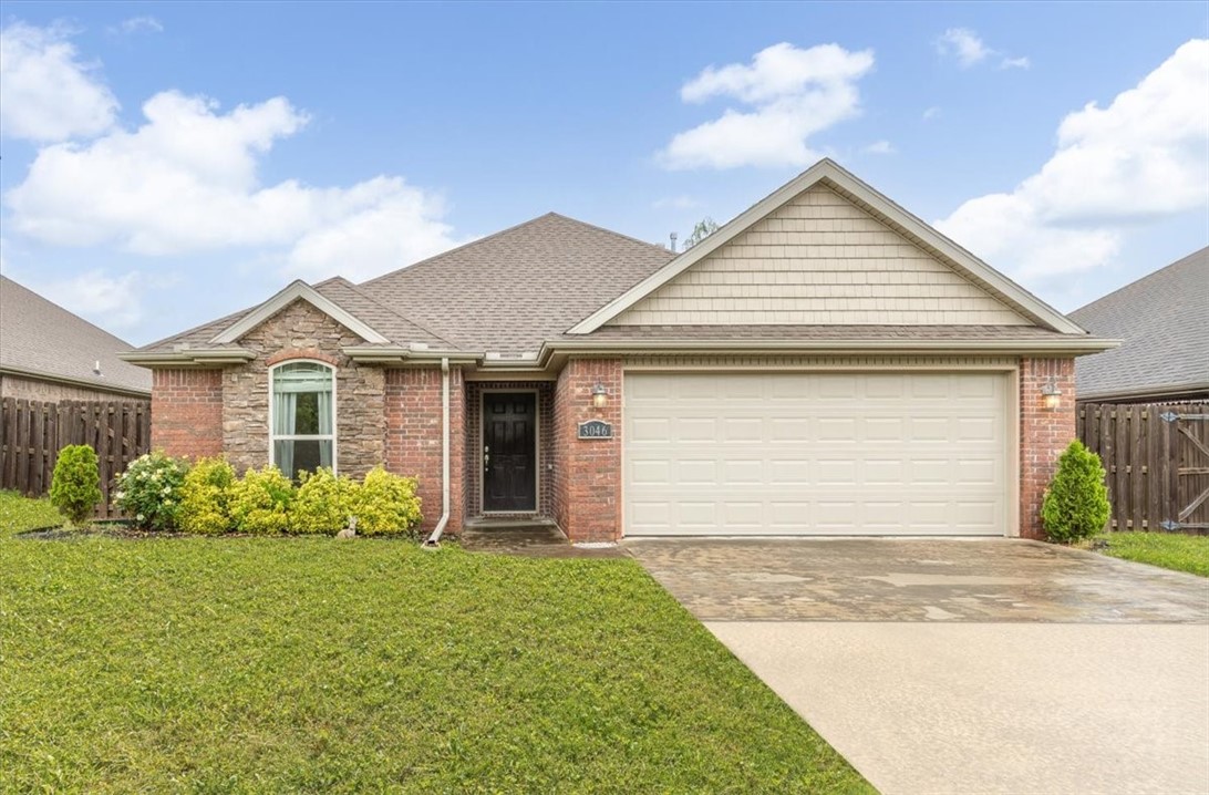 Charming, well-maintained home in one of Fayetteville’s most desirable areas! Conveniently located near shopping, dining, and quick access to I-49, this home offers both comfort and convenience. The curb appeal is undeniable with its attractive exterior and welcoming presence. Inside, the split floor plan provides function and privacy, featuring stylish finishes like granite countertops, rich wood flooring, a cozy fireplace, and more. Step outside to enjoy a spacious, fully fenced backyard with a large patio — perfect for entertaining or relaxing in your own private retreat.