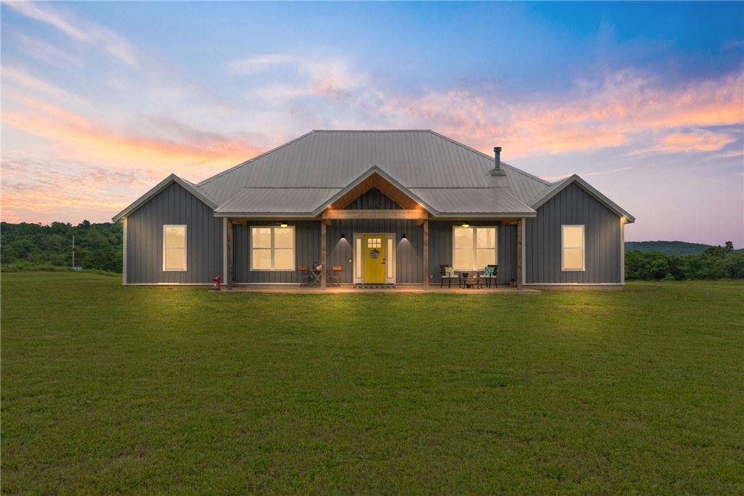 Welcome to your stunning, recently finished out, new home on 20+ beautiful, flat acres with amazing views all around! Just 25 minutes from Fayetteville, you'll love all of the modernization in the Gourmet kitchen w/ Café® smart double oven (WiFi, air fry), commercial grade fridge, and huge butcher block island is a chef's dream! All new Luxury Vinyl and tile flooring! Featuring a whole home water filtration system, 4 spacious bedrooms, massive laundry area and primary closets, newly finished bathrooms and lots of storage space. Gorgeous wood burning fireplace! Wired for whole-home generator and for heated floors. Plenty of pasture for horses, livestock, mini-farm and a garden with wire fence surrounding the property that includes an older walk-thru horse barn w/round pen!! This is where modern luxury meets beautiful country living! A rare find with the best of both worlds!