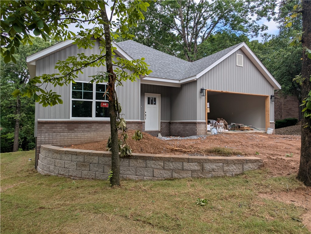 Discover modern comfort in this brand-new Hillington floorplan home, perfectly situated on a quiet cul-de-sac in beautiful Bella Vista, Arkansas. This thoughtfully designed 3-bedroom, 2-bath residence offers 1,688 square feet of stylish living space, featuring an open-concept layout, spacious bedrooms, and quality finishes throughout. Enjoy peaceful surroundings, new construction peace of mind, and convenient access to all the natural beauty and amenities Bella Vista has to offer. Ideal for those seeking both tranquility and modern living.