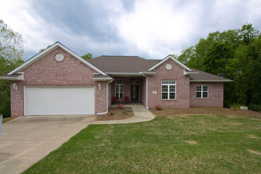 5 minutes to Beaver Laker and 5 minutes to Downtown Rogers & overlooking the 16th hole of Prairie Creek Golf Course!! One owner, custom built home! 2x6 construction with 10' concrete walls. Home is looking down hole #16 Prairie Creek Golf Course. Wonderful neighborhood on cul-d-sac.  Wood floors & painted thru out, new stainless appliances including double convection oven, refrigerator & dishwasher. Huge game room & media room downstairs has been plumbed for hot & cold wet bar with one bedroom or could be turned into an office, and a full bath down stairs. Two complete two car garages, with a bonus shop area in the downstairs garage. The attic above the main level garage is completely finished with flooring and lights! Level fenced area backyard with retainer wall & additional fenced yard for pets. Close to restaurants, 5 minutes from Beaver Lake & Prairie Creek Marina & Hobbs State Park.  Home is ready to move in.  Spectacular home with excellent price.