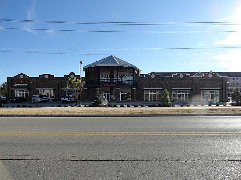Commercial investment property. Tenants - Foghorn's, La Hacienda, Liquore Store (to be finished), 1,500sqft office. To be finished, great location close to U of A. Directly across from Razorback Baseball Stadium.