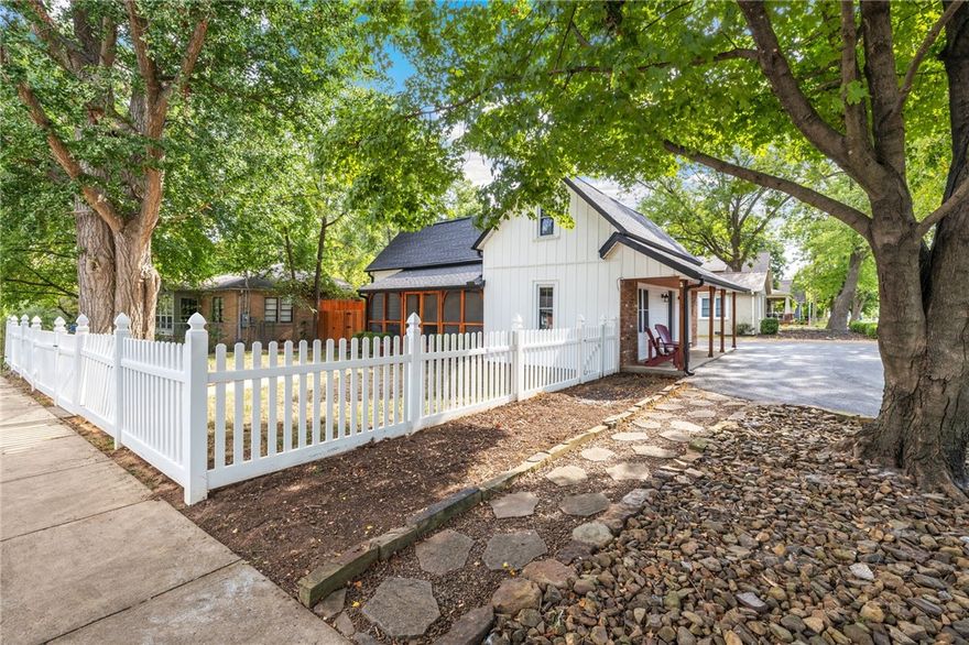 Discover the allure of historic living in the heart of Bentonville. This captivating home, nestled on iconic SW E St., offers a perfect blend of charm and modern comfort.  Step onto the screened-in porch and embrace the quintessential Bentonville lifestyle. Inside, you'll find a fusion of original character and thoughtful updates. Recent improvements include a new electrical service, HVAC system, roof, and updated bathrooms, ensuring both comfort and peace of mind.  The main level boasts a welcoming open floor plan encompassing the living and dining areas, creating an ideal space for entertaining. Two bedrooms are conveniently located on this floor and have their own full baths.  Upstairs, discover three additional bedrooms and a spacious bathroom. This home offers ample room for family and guests.  Immerse yourself in the vibrant downtown Bentonville scene.  This is your opportunity to own a piece of history while experiencing the best of modern living.  Don't miss your chance to make this historic gem your own.