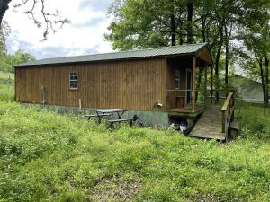2 older homes on this land sold AS IS Tiny house in very good condition 2 septic tanks and 2 water meterspretty trees and fenced all-around . paved road fronts this nice piece of land only minutes from Harrison . land has 1.5 acres m/l .old storm cellar this property has lots of potential.front Deck ,outside faucets