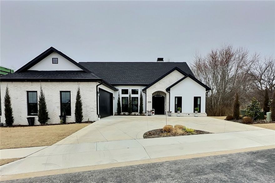 Gorgeous newly built custom home located in the prestigious Clear Creek Patio Homes Subdivision, an exclusive gated golf community featuring The Blessings Golf Club. Conveniently located off I-49 in Johnson near Arkansas Childrens Hospital, Tyson and the University of Arkansas. This 5014 sq ft home offers 3 bedrooms on the main level with 2 more bedrooms in the full walkout basement. The private, flat lot would be perfect for a pool. Set up your showing today.