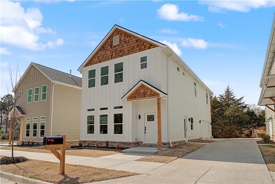 Seller to pay up to $5,000 of buyer’s closing costs, prepaids and/or loan rate buydown. Additional money potentially available from Preferred Lenders to contribute to rate buydown. Could qualify for FHA loan. Details available from lenders. Lender list available. Beautiful new single-family home with 3 bedrooms, 2.5 bathrooms and 2-car garage. All bedrooms upstairs including primary bedroom with on-suite primary bathroom including a walk-in shower, soaking tub and walk-in closet. Inviting open floor plan downstairs with living area with electric fireplace, kitchen with custom cabinets, dining area and powder room/half bath. High main-level ceilings. Laundry is upstairs. Neighborhood green space. Prime location in South Fayetteville that is 1 mile from Happy Hollow Elementary School and also near Mt Sequoyah Woods & Trail & Stonebridge Meadows Golf Club. ~ 3 miles to the U of A and Fayetteville HS. Interior photos are virtually staged and for marketing purposes only. No furniture included.