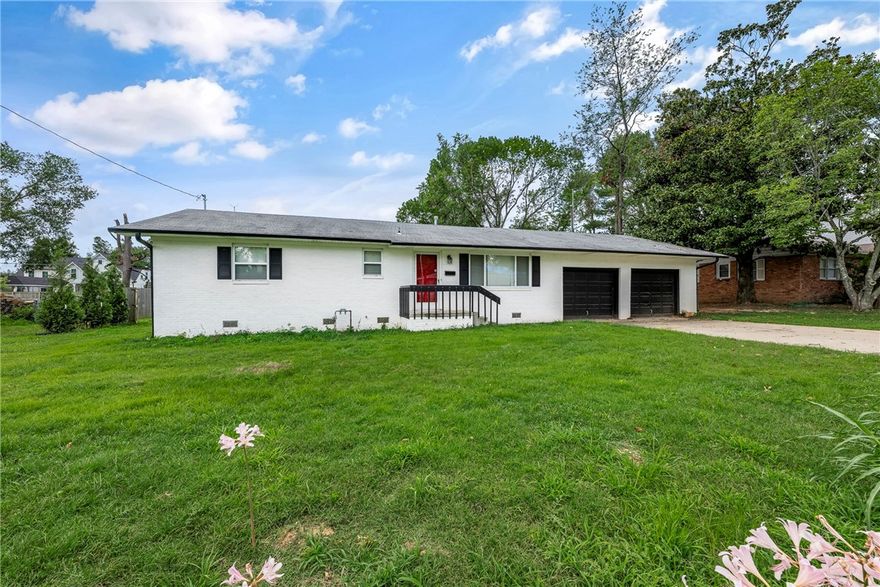 Prime investment opportunity in a GREAT location! Less than 1 mile from Downtown Bentonville square! Situated on a .37-acre lot, this home has outstanding potential. Home is in the middle of renovations with modern updates completed. Current plan features vaulted ceilings and open concept in main areas. Framing is complete and original hardwood floors are intact. Along with a new mudroom/garage entry and butler pantry, this home features a large 2 car garage as well. This home has great structural integrity and is in the perfect state to finish. Potential to divide lot into 2 parcels is available. Opportunity to have house fully gutted as well! This fixer-upper prospect is perfect for those looking to customize and create their dream home!  This is also listed as land - see MLS 1282395.