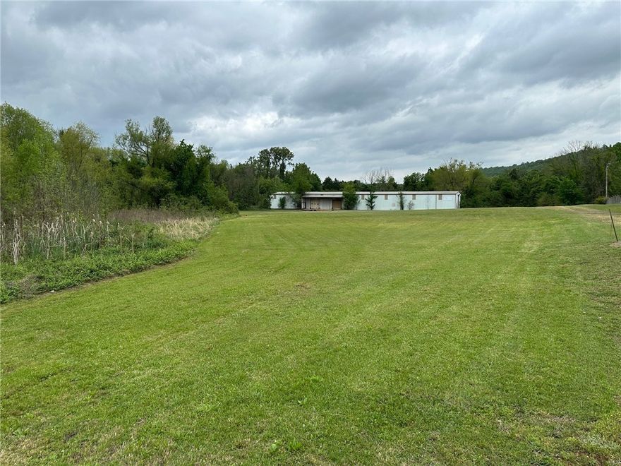 Commercial acreage and warehouse on the east end of Russellville. Fantastic location near truck stops, I-40 and Russellville commercial corridor.