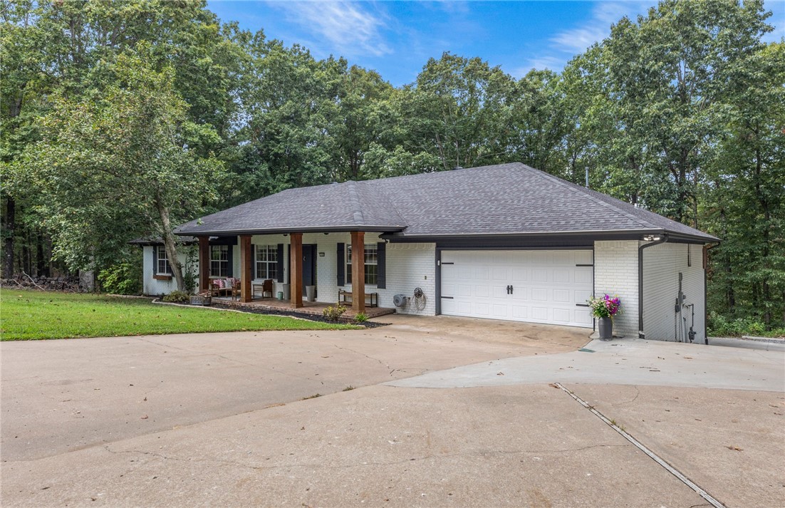 5 minutes from Beaver Lake, with extra RV/Boat Parking! Situated on a spacious 3-acre corner lot in a peaceful subdivision, this property is surrounded by mature trees, offering a serene retreat. Conveniently located close to Lake Atalanta and a short drive to vibrant downtown Rogers and the Railyard. Discover the perfect blend of nature and convenience in this charming home. The home was Remodeled in 2016, the spacious open floor plan greets you as you walk in. The main floor features two luxurious primary suites with remodeled bathrooms and spacious closets. Two additional spacious bedrooms, a full bath, and an office join the main floor for a convenient floor plan. Downstairs you’ll find a large open Game Room/Man Cave/Bonus Room/Media Room/Full bath/and extra bedroom. The attached workshop is also heated/cooled/and insulated.
Park like 3 acre lot with expanded parking for RV or Boat. Water Heater and Roof replaced 2016. Back deck replaced 2022. Extra storage closet downstairs. No POA