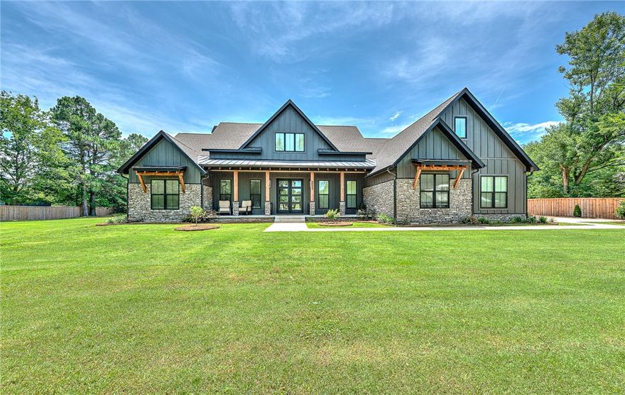 Welcome to this beautiful oasis on the North side of Springdale. Enter the property through automatic rod iron privacy gate, concrete drive to the 3 car garage. Built in 2023, Added pool w/waterfall and 25 x 35 Shop building with 10' double garage door for RV/Boat (multiple outlets with 220).  Walk into this bright open 3200' floor plan with a chef's kitchen, including a hidden pantry with a built-in microwave. Enter the beautiful living area, with an open view to the private backyard, the pool with a waterfall, fireplace/relaxing area and the outdoor cooking area with Bull appliances. The 3 infrared 6000 BTU heaters keeps things cozy in winter. Back inside you'll find the comfort of dual thermostat controlled air, security system, tankless hot water, gas heating system, and even a 5'x7'x5' NWA Storm Shelter in the garage. The Primary suit boasts a beautiful soaker tub and walk-in shower with plenty of space, including the closet! Split floor with a 2nd, 3rd bed and office, and the bonus room is upstairs. Enjoy!