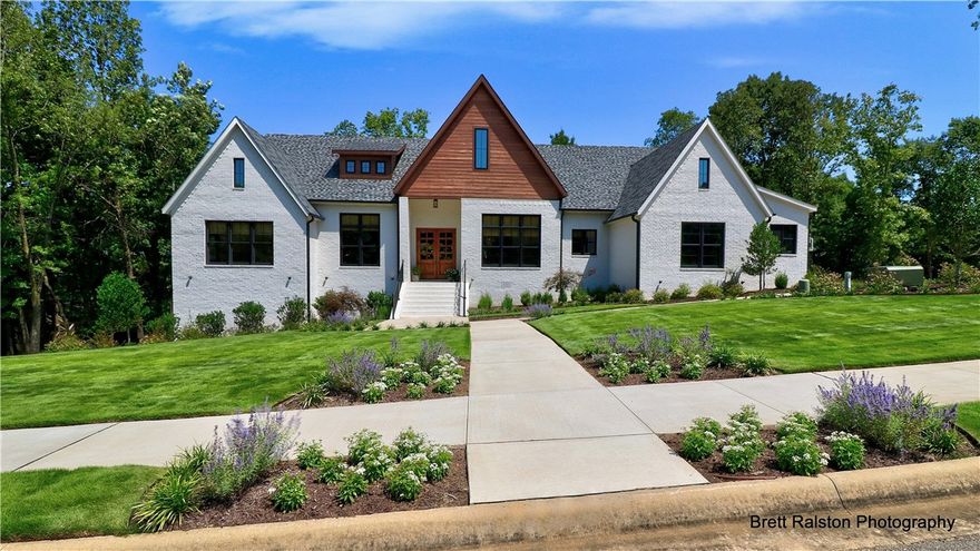 Amazing custom-built, one-owner home with outstanding attention to detail. Home is featured in the latest issue of Arkansas At Home. It is open, airy, spacious featuring large windows, 4 BR, 4.5 BA, upgraded lighting, Bertazzoni stainless KIT appliances, wood floors in living areas & BR, carpet in media room. Second LR/Bonus rm on main level & bonus room on lower level. Quartz & granite countertops in KIT & Baths. Master bath has Slate tile flooring, Porcelain wall tile. Situated at the end of a cul-de-sac, yard is private, gorgeous landscaping & a wonderful place to call Home.