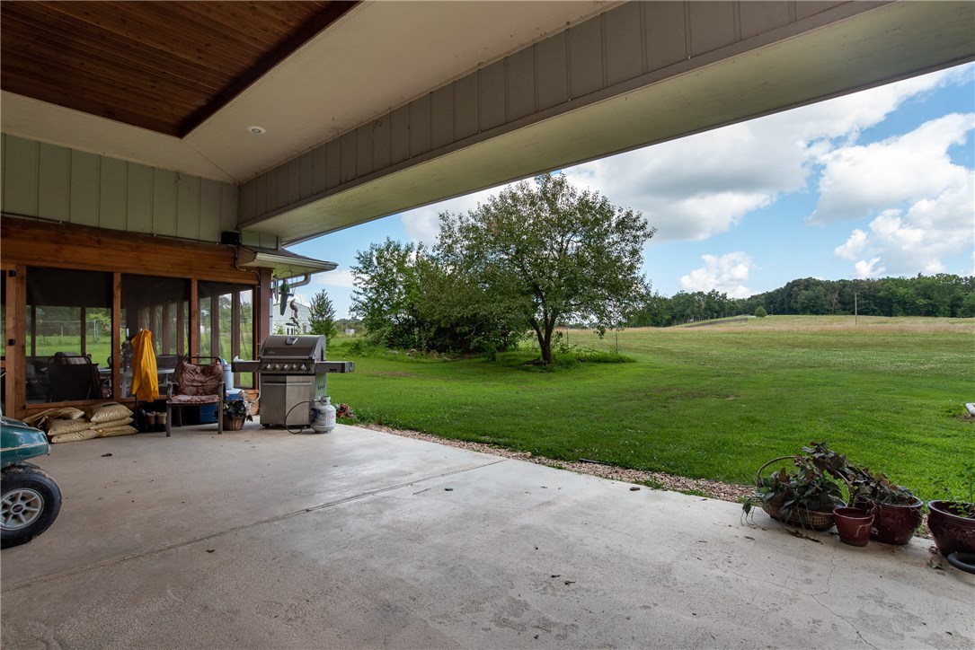 Beautiful 4 bed/3.5 bath country home on 40 acres, creek frontage, wrap around porch, additional storage in the shop, stable, fenced ready for cattle and so much more. Inside, this home boasts beautiful hardwood floors in kitchen and dining area and large windows to let in natural light. There’s an open, spacious floor plan perfect for entertaining. The kitchen is set for a chef, with large island and double stove that opens to the enclosed sunroom. Other amenities in this home are a brick fireplace and wood stove, large deck overlooking the creek and TONS of storage. Lovely master suite with ensuite with whirlpool tub. Property is across the road from Horton Farms that's surrounded with walnut trees. You do NOT want to miss this home!