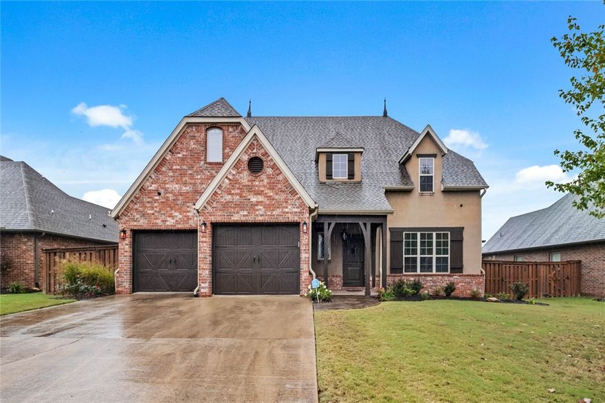 Welcome to extremely sought after Chapel Hill Subdivision where kids are abundant and families are friends. Enjoy the walking trails and Milk Run Biking Trail then head to the community pool and clubhouse where the kids can swim or play on playground and the adults can relax. European style home with beautiful landscaping invites you to swing open your new front door and bask on the brand new hardwood floors leading you to the formal living area with a large window beaming natural light. Continue to the dining room with french doors to outdoor pergola. The modern kitchen is perfect for families with an island, large pantry, cathedral ceiling nook, and opens to another large living area perfect for entertaining. Primary is on main floor with ensuite featuring dual vanities, tiled shower, tub and WIC. Upstairs adds 3 more bedrooms, 2 full baths and a large media room to get away from life and watch the game. Flat fenced backyard, new roof in 2022 and just minutes to Crystal Bridges, Amazeum, Orchards Park and I49.