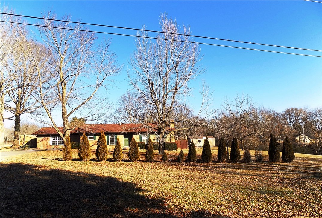 All brick home located on 2.11 acres. Bring your cows, horses, donkeys, goats - whatever you choose! Plenty of room to roam and wonderful in-ground pool! Great access to everything Siloam has to offer, no dirt road! A three bedroom two bath home with 2-living areas. Upgraded bathrooms, newer windows, and new roof, HVAC in 2020 and new how water heater in 2021. Need some paint & a little TLC.
