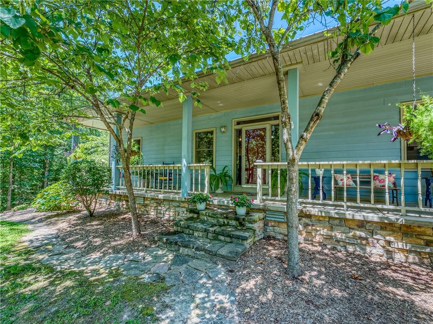 Stunning property located at 6122 Scenic Valley Drive, Harrison, AR, offering 30 private wooded acres with Terrapin Creek running through the land. This peaceful retreat features a 3 bedroom, 3 full bath, and 1 half bath home designed for comfort and entertaining, with potential for a 4th bedroom by dividing an existing upstairs bedroom. The home showcases a cathedral ceiling living room with wood-burning fireplace insert, spacious kitchen and dining area, plus a cozy sunroom off the primary bathroom. An office provides access to the unfinished basement for additional storage or flexible space. Outdoor living includes a screened-in porch with wood-burning fireplace leading to a heated in-ground pool with wraparound sun deck and firepit area. Property also includes a pool equipment outbuilding and detached barn/workshop. Abundant wildlife and privacy just 30 minutes to the Buffalo River and 45 minutes to Branson, MO.