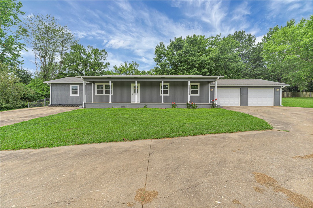 Step into this beautifully renovated 4-bedroom, 3-bath home offering 1,876 sq ft of modern comfort and style. Featuring two spacious en-suites, this home is ideal for families or multi-generational living. The brand-new kitchen shines with new cabinetry, granite countertops, and a full set of Frigidaire appliances. All bathrooms have been tastefully updated with matching granite for a cohesive, upscale feel. Enjoy peace of mind with a long list of upgrades including new HVAC, water heater, windows, doors, LED lighting, ceiling fans, insulation, gutters, and fresh interior & exterior paint. Flooring throughout has been updated, and both garage doors are insulated with new openers installed. Outside, you'll find a huge 2-car garage plus additional garage space, ample concrete parking, and a large rear patio perfect for entertaining or grilling. Conveniently located near schools, shopping, and diningāthis Huntsville gem checks all the boxes. Schedule your showing today!