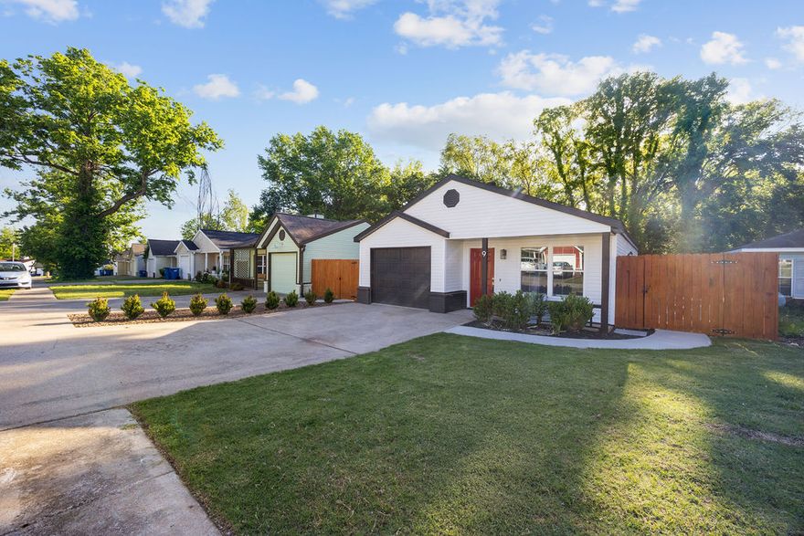 Completely remodeled and move-in ready in the heart of Bentonville! This 3 bedroom, 2 bathroom home offers stylish updates throughout with fresh paint, new LVP flooring and carpet, new showers and tubs, a new sliding door, and an open, inviting layout with a wood burning fireplace for those chilly nights. A new refrigerator, washer, and dryer convey with the new oven and microwave rounding out a set of worry free appliances. Outside, enjoy newly built composite decking connecting right to the patio, fresh backyard landscaping, new privacy fencing, and a new sidewalk from the patio to the driveway for easy access and functionality. The backyard is also grass free for very low maintenance. The garage features a newly sealed floor, adding a clean finished touch and a new wifi connected garage door opener. Located just steps from biking trails and only 1 mile from downtown Bentonville, this home combines modern updates with an unbeatable location close to dining, entertainment, and everything the city has to offer.