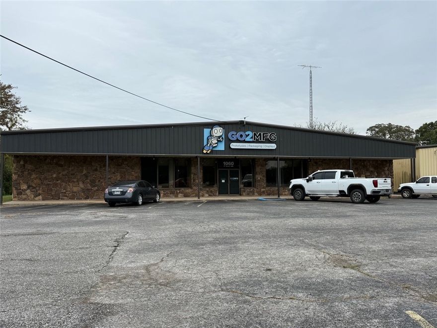 This well-conceived property features three interconnected buildings, joined by breezeways, each serving a distinct function that enhances flexibility and revenue potential: 
1. Primary Building (~12,000 SF, climate controlled)
o Lobby, restrooms, offices, kitchenette, storage, and open display/assembly floor
o Ideal for light manufacturing, showroom, R&D, or hybrid usage 

Property is available for sale see MLS 1324853
2. Large Open Warehouse (~9,700 SF)
o High-clearance space, loading dock, overhead door access
o Suitable for inventory storage, distribution, light fabrication, or logistics operations
3. Garage / Residential Component (~1,697 SF per level)
o Ground floor: four-bay garage / workshop
o Upper floor: carpeted apartment with 2 bedrooms, kitchen, living area, bath, laundry
o