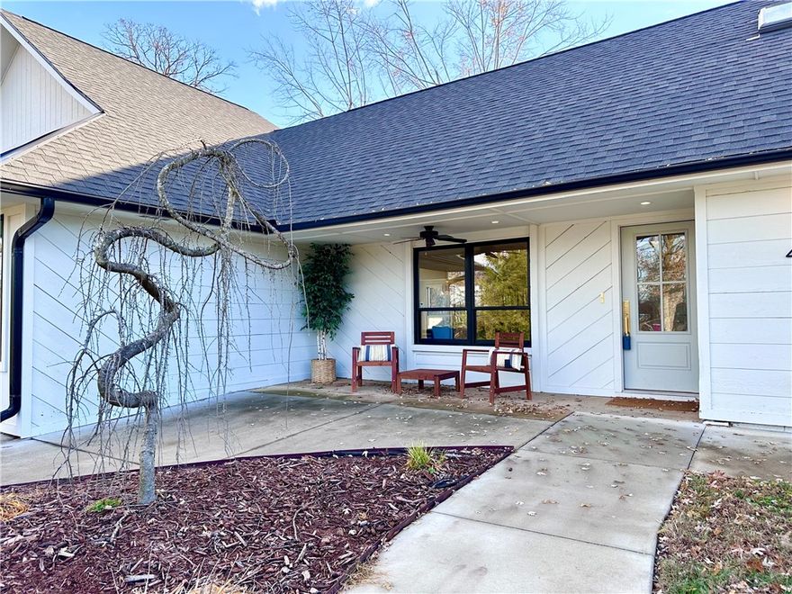 Exquisite living awaits in this beautifully remodeled home, perfectly situated near the serene Park Spring Park and vibrant downtown Bentonville. Designed with entertaining in mind, the expansive gourmet kitchen boasts a massive island, Fisher & Paykel six-burner professional range, double ovens, and dual pantry areas. Soaring vaulted ceilings in the dining area flow seamlessly into the living room, complete with a chic bar and inviting fireplace. Gleaming hardwood floors span most of the home. Meticulously transformed in 2023, this home features new roofing, upgraded mechanicals, and elegant finishes throughout. The luxurious primary suite delights with a wet-room-style shower, premium fixtures, and a cozy sitting nook. A dedicated office space with private patio access adds versatility.
Outside, unwind on the covered patio with a grilling station, or take advantage of the powered storage building in the lush backyard. A masterpiece of comfort and style!