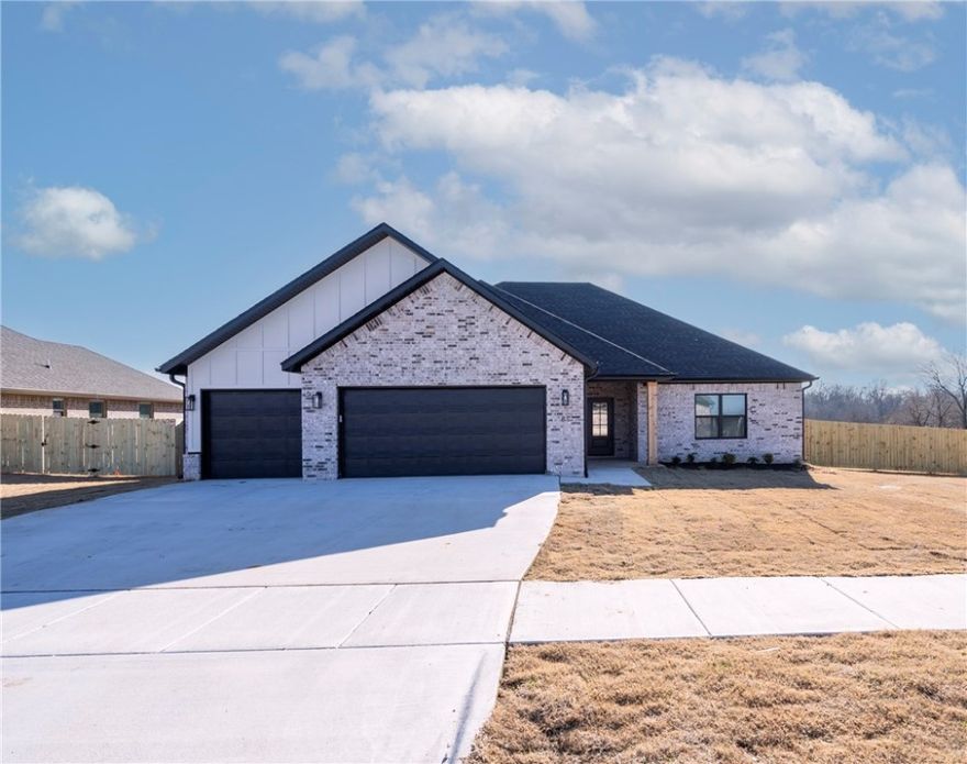 Quality craftsmanship and attention to detail define this newly constructed home. Designed with both function and style in mind, the open floor plan features vaulted ceilings, durable wood-look tile flooring, and a custom fireplace that anchors the living area. The kitchen showcases soft-close white cabinetry, granite countertops, stainless steel appliances including a gas range, under-cabinet lighting, and an oversized island with bar seating. A large walk-in pantry adds smart storage. The primary suite offers a tray ceiling and a well-appointed bath with dual vanities, a soaking tub, a fully tiled walk-in shower, and an expansive walk-in closet. Exterior highlights include a covered back patio, full fencing, gutters, and energy-efficient construction throughout. Built with quality materials and modern finishes, this home delivers lasting value and is