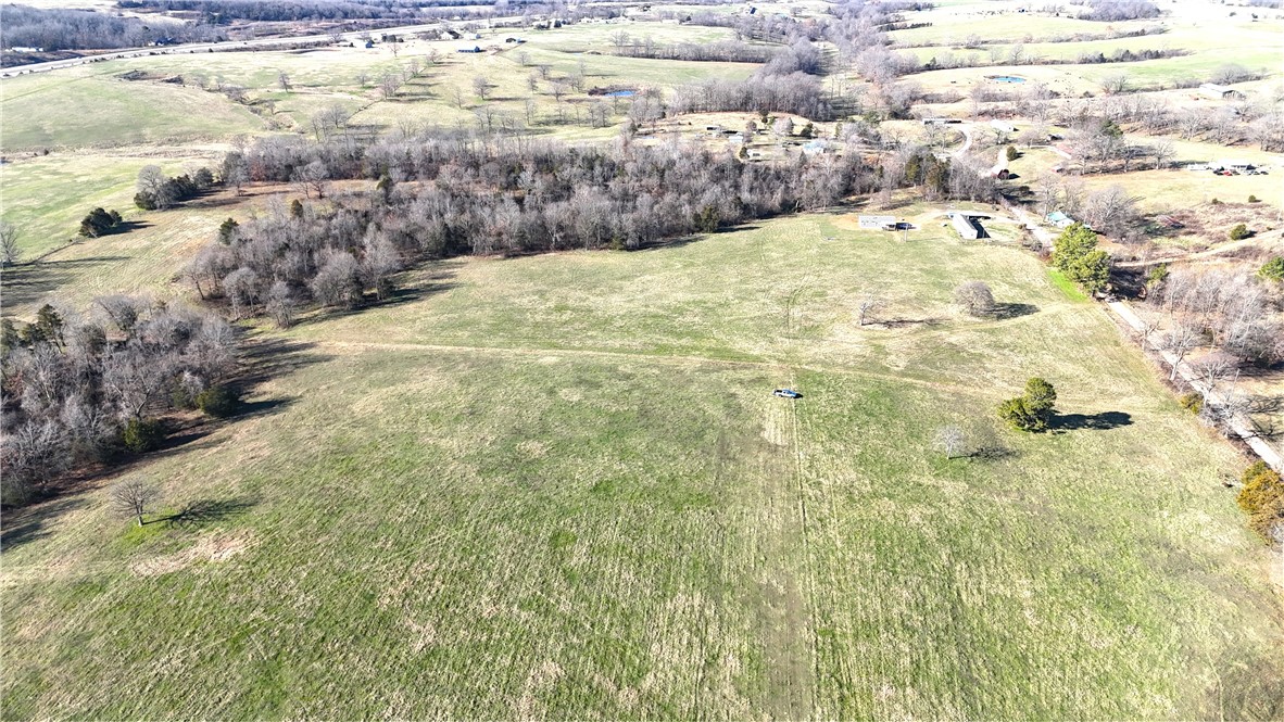 Don't miss this prime tract of land ready for your new home build! Mostly open, all useable 13.31 acres provides a country feel with room to breathe. Great access with county road frontage and short distance to pavement. Rural water, electric, fiber at road. Quick access to Hwy 412 and nearby amenities, 25 minutes to Fayetteville/Springdale. This scenic property combines an ideal out of town setting with convenience to necessities. Call for an appointment to take a look today! Utility availability is the responsibility of the buyer or buyers agent.
