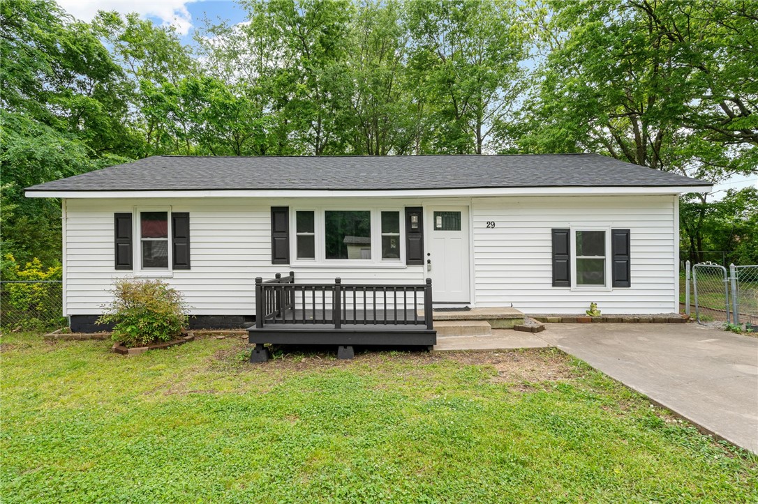 You're going to love this cute and cozy home with so many brand new updates! It's located in the heart of Mulberry on a level, shaded lot with chain link fencing. The home has a one year old roof, new windows, doors, flooring, paint, lights, cabinet doors, countertops, sinks, tub/shower unit and some electrical & plumbing updates. If you're tired of the hustle & bustle and ready for small town living, Call for your showing today!