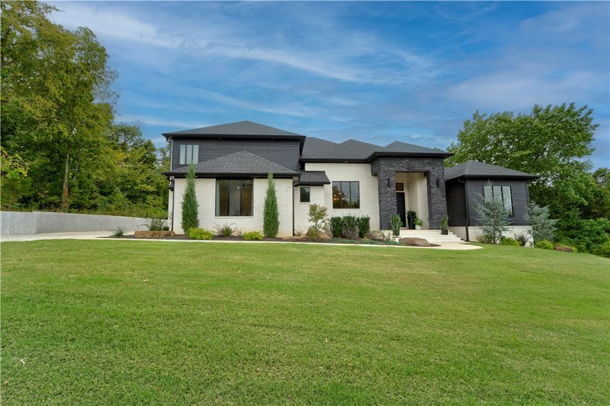 Looking for a beautiful home in East Fayetteville? You're in luck! This beautiful home sits on just over an acre in one of Fayetteville's best neighborhoods. With a large, open, and modern feel this home offers an amazing layout for hosting friends and family. With 5 bedrooms, 4 full baths, a main level office, and a walk in laundry room it is perfect for a large family. You will be near multiple elementary schools, McNair Middle School, and Fayetteville High School. To top things off, you walk out onto a large, covered patio that looks out at the backyard with a lot of mature trees and tons of privacy.