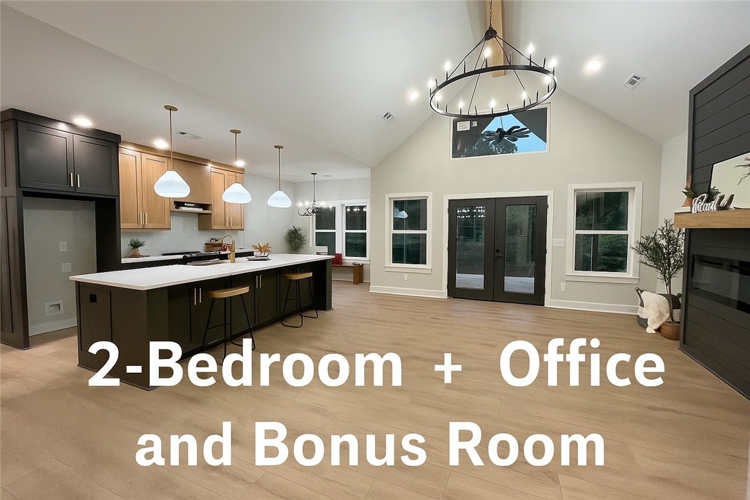 Nestled on a quiet cul-de-sac with wooded views, this stunning modern home offers the perfect mix of style, comfort, and privacy, set on a nearly flat lot next to Tunnel Vision. The open-concept floor plan features vaulted ceilings, abundant natural light, a dramatic fireplace, & a chefās kitchen with a large quartz island, custom white oak cabintry, & a spacious walk-in pantry. Offering 2 bdrms + an office & bonus room/huge loft complete w/ its own kitchenette and full bathāideal for guests, hobbies, or a private retreat. The luxurious primary suite provides a spa-like bath & generous closet space, while additional features such as modern lighting, elegant finishes, and a seamless flow to outdoor living enhance the homeās warmth & functionality. Step outside to enjoy the gorgeous back deck overlooking peaceful wooded views, perfect for entertaining or quiet relaxation, making this home a true retreat with space, flexibility, & natural beauty all in one. Donāt miss this rare beautyābook your tour before itās gone!
