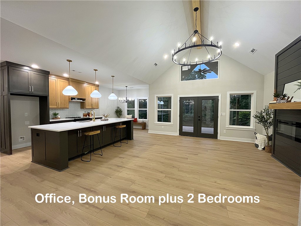 Nestled on a quiet cul-de-sac with wooded views, this stunning modern home offers the perfect mix of style, comfort, and privacy, set on a nearly flat lot next to Tunnel Vision. The open-concept floor plan features vaulted ceilings, abundant natural light, a dramatic fireplace, & a chef’s kitchen with a large quartz island, custom white oak cabintry, & a spacious walk-in pantry. Offering 2 bdrms + an office & bonus room/huge loft complete w/ its own kitchenette and full bath—ideal for guests, hobbies, or a private retreat. The luxurious primary suite provides a spa-like bath & generous closet space, while additional features such as modern lighting, elegant finishes, and a seamless flow to outdoor living enhance the home’s warmth & functionality. Step outside to enjoy the gorgeous back deck overlooking peaceful wooded views, perfect for entertaining or quiet relaxation, making this home a true retreat with space, flexibility, & natural beauty all in one. Don’t miss this rare beauty—book your tour before it’s gone!